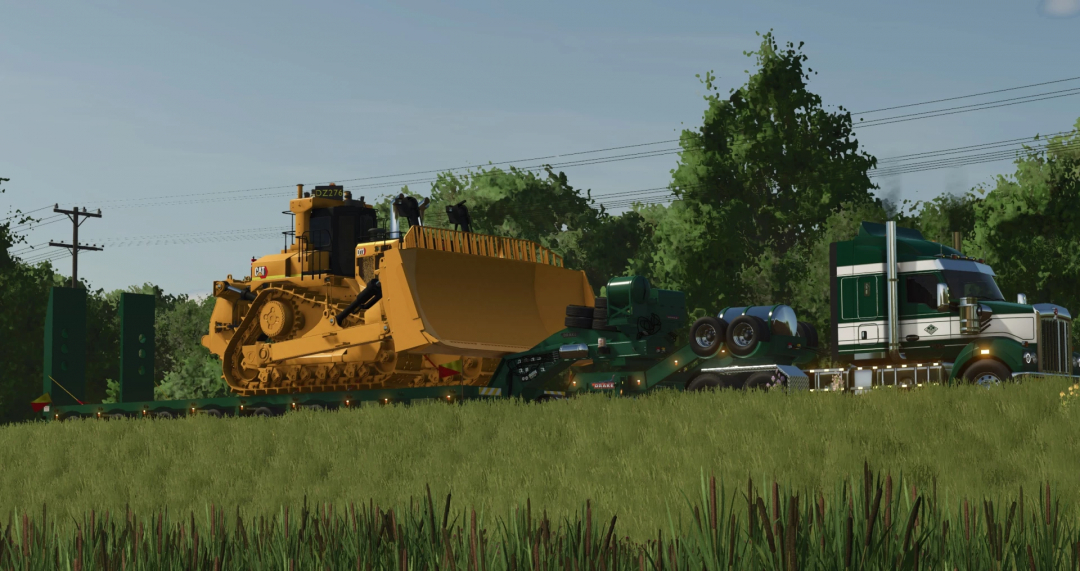 FS25 Drake Dolly and Platform Pack mod featuring a truck transporting a large bulldozer through a grassy area.