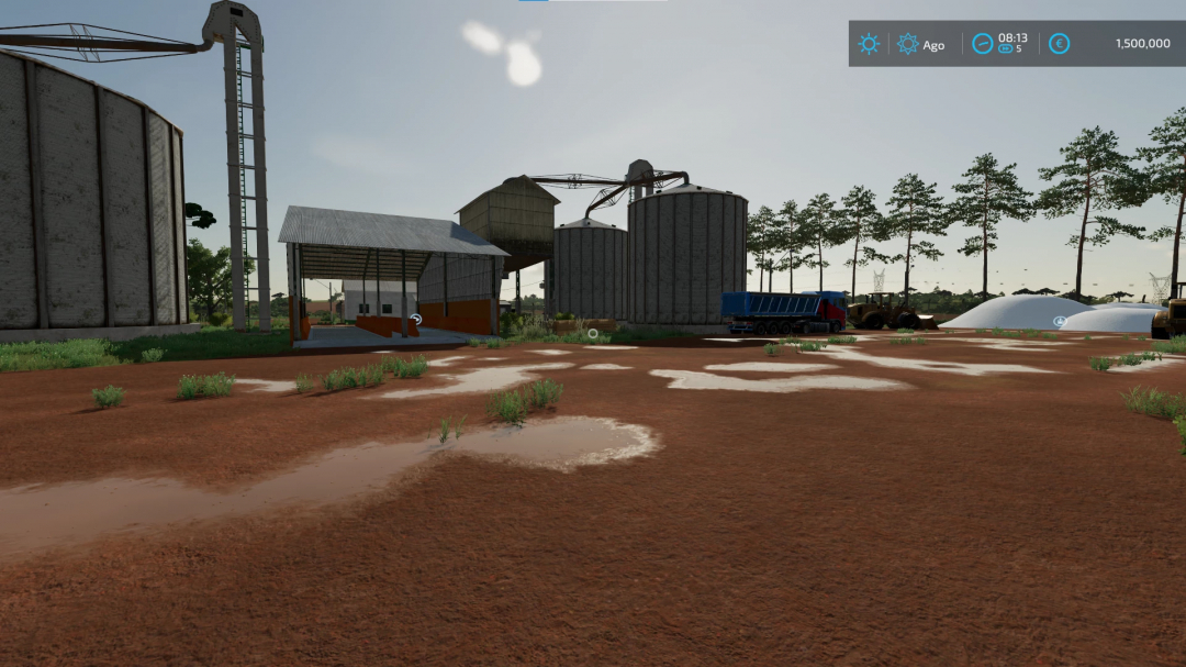 FS22 mod Fazenda Ourinhos Map v1.0.0.0, featuring farm storage and equipment on a muddy terrain.