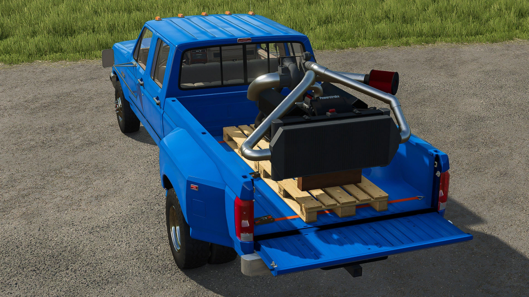 Blue truck with Ford 7.3 PowerStroke Turbo Diesel engine mod in bed, FS25 mods.