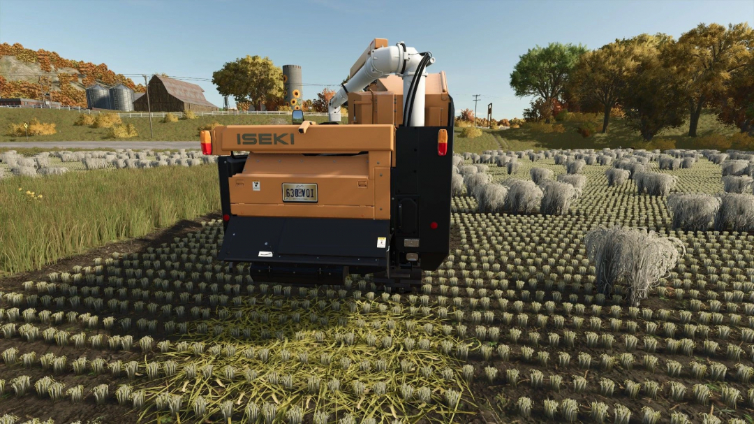 Iseki rice harvester 50m in FS25 mod, working in a field with harvested bundles, showcasing Farming Simulator 25 mods.