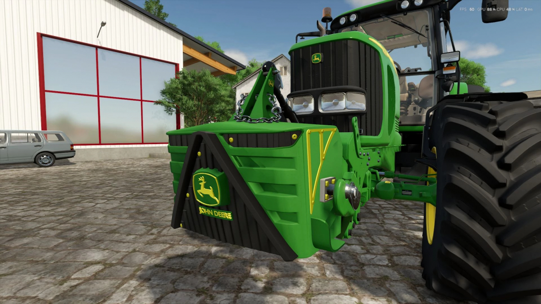 John Deere 800kg weight mod for FS25, attached to a tractor in a farm setting.