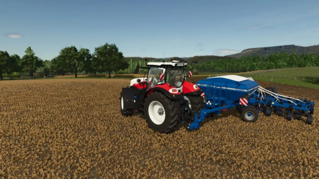 Köckerling Ultima 800 mod for FS25, showing a blue seeder attached to a red tractor in a field.