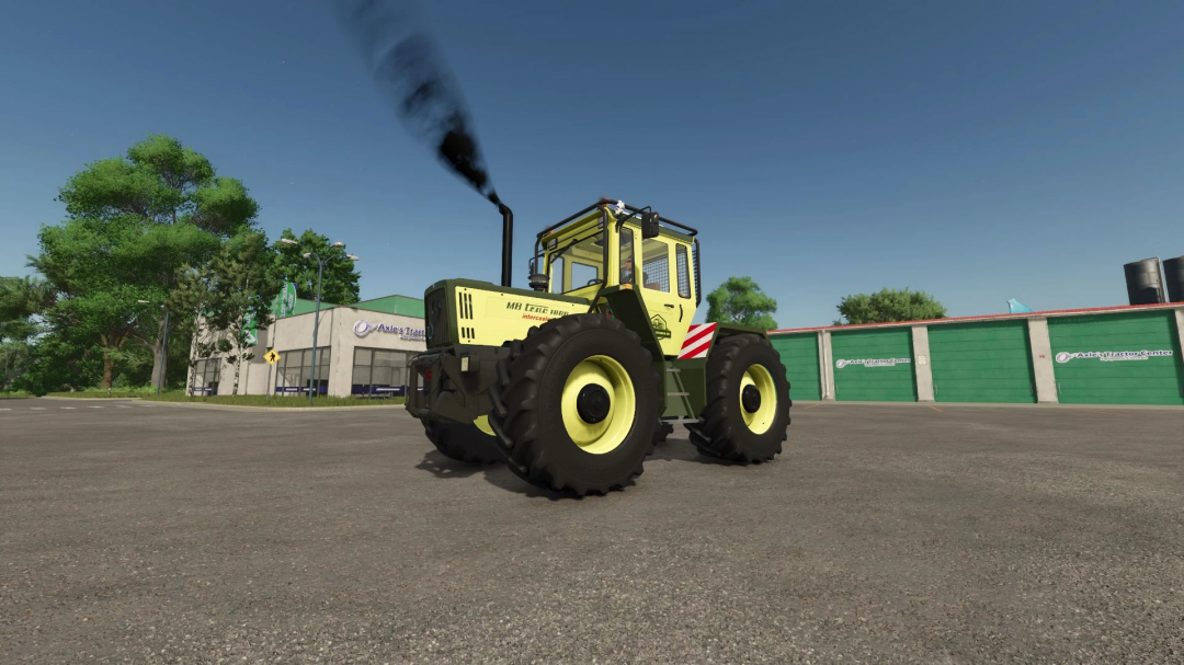 MB Trac Edition tractor mod for Farming Simulator 25 with exhaust smoke, parked near a tractor center building.