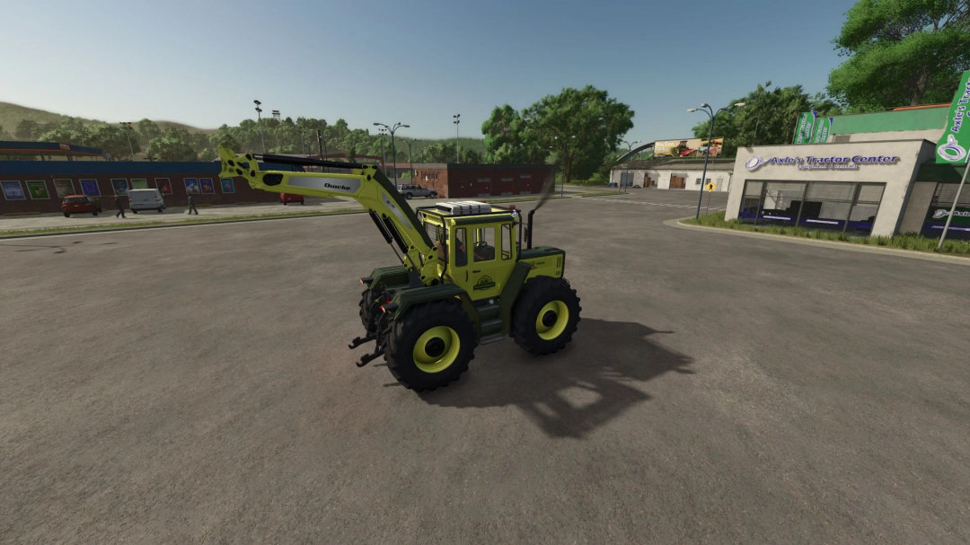 MB Trac Edition v1.0.0.0 mod in FS25, featuring a green tractor with front loader in a farm simulation parking area.