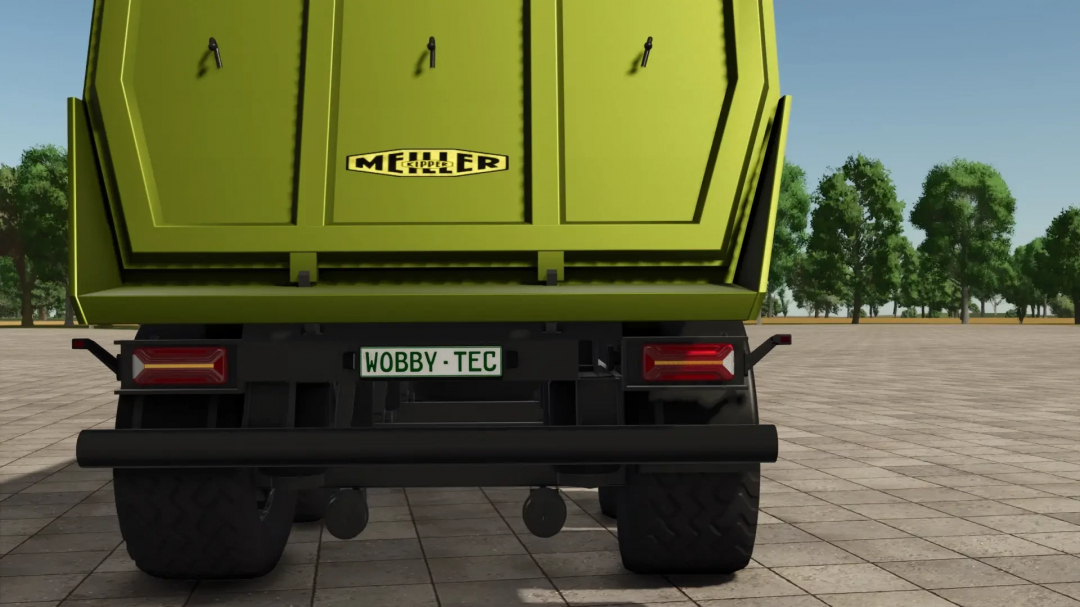 Rear view of Meiller Tipper automatic LiftAchse mod in FS25, showcasing the green trailer and WOBBY-TEC license plate.