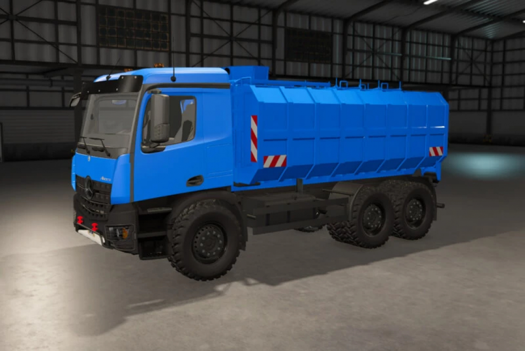 Blue milk truck mod for FS25 inside a garage, showcasing its design and features.