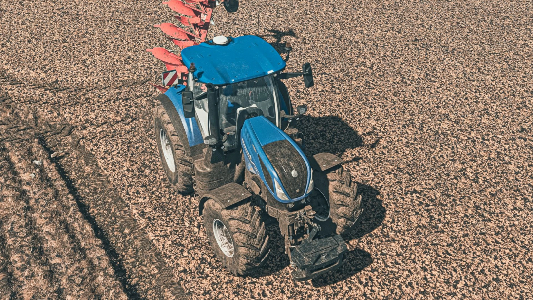 New Holland T7 tractor mod in FS25 on a plowed field.