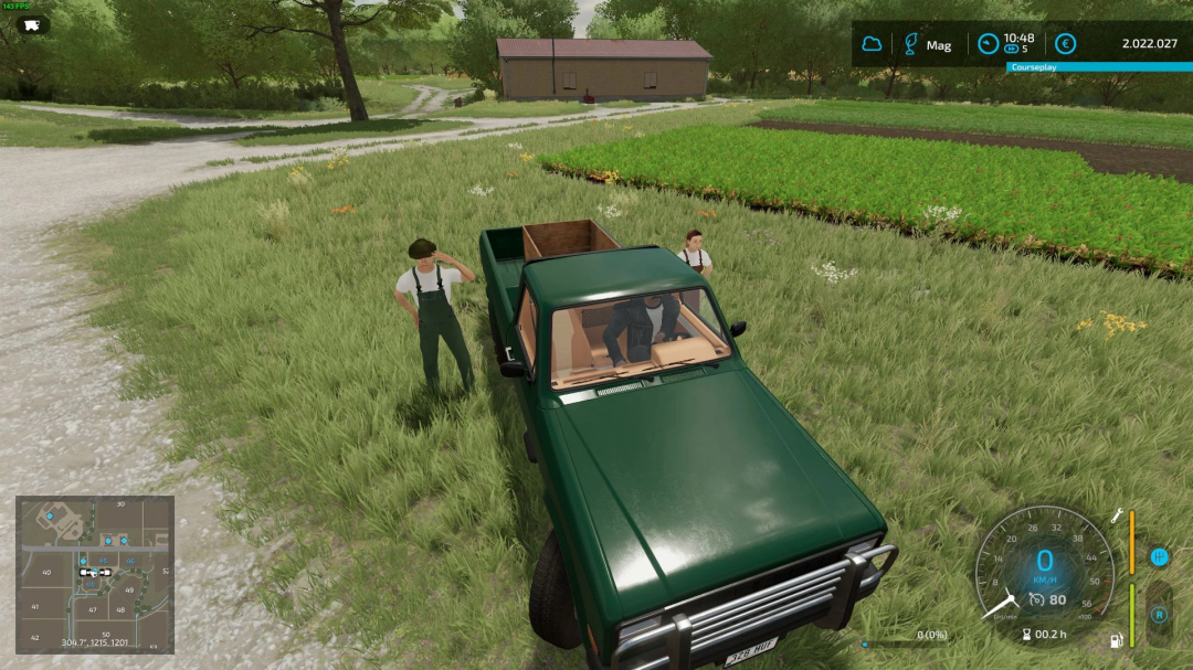 FS22 mod Pickup Hand Harvester on a farm with two characters nearby; green farmland setting.