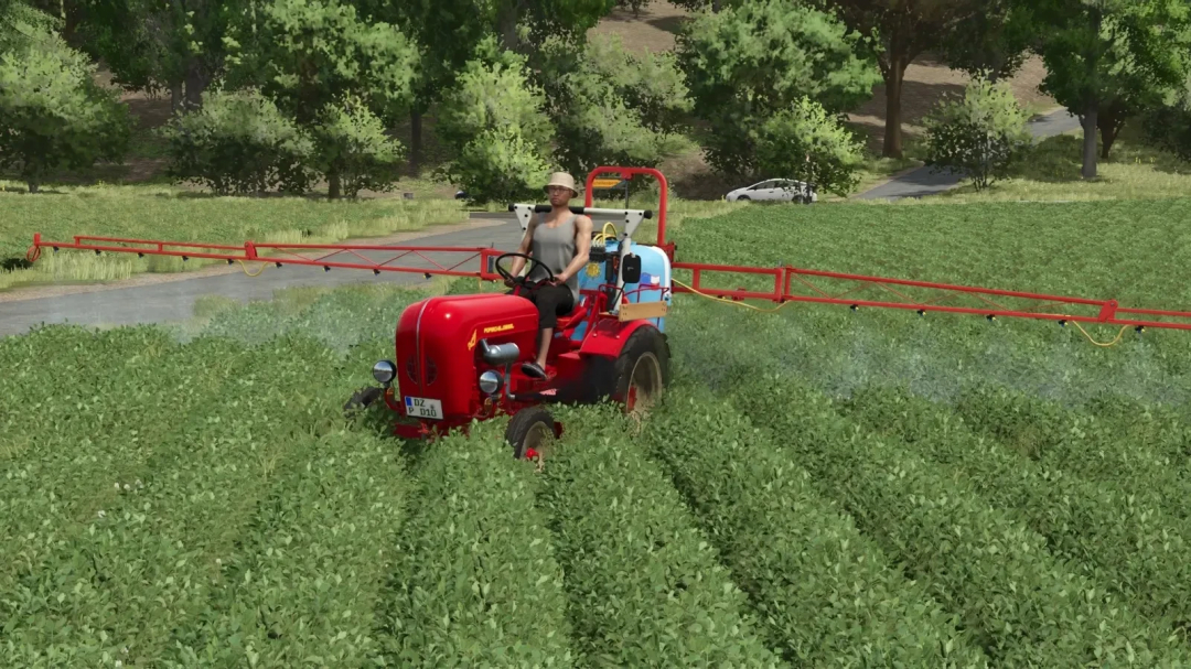 Porsche Diesel Junior 108 tractor spraying crops, FS25 mod.