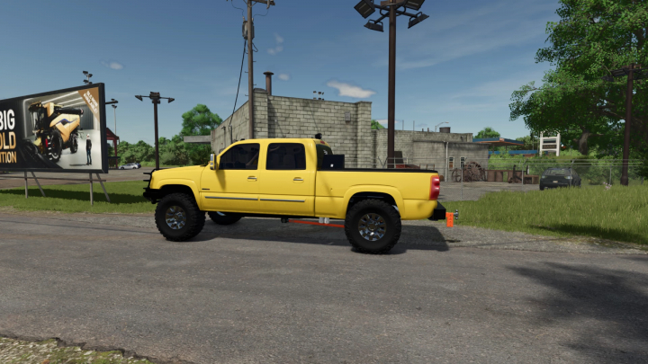 fs25-mods,  Yellow 2005 Chevy 3500 truck mod in FS25 near a billboard.