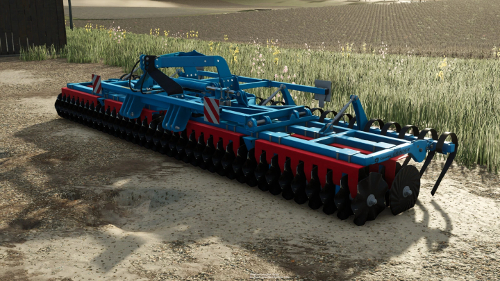 fs25-mods,  Gorenc Grinder 600 mod in Farming Simulator 25, showcasing a blue and red agricultural implement on a dirt path.