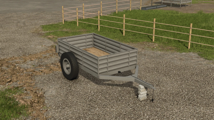 fs25-mods,  FS25 mod showing a two-wheel trailer on a paved lot with grass and fence backdrop in Farming Simulator 25.