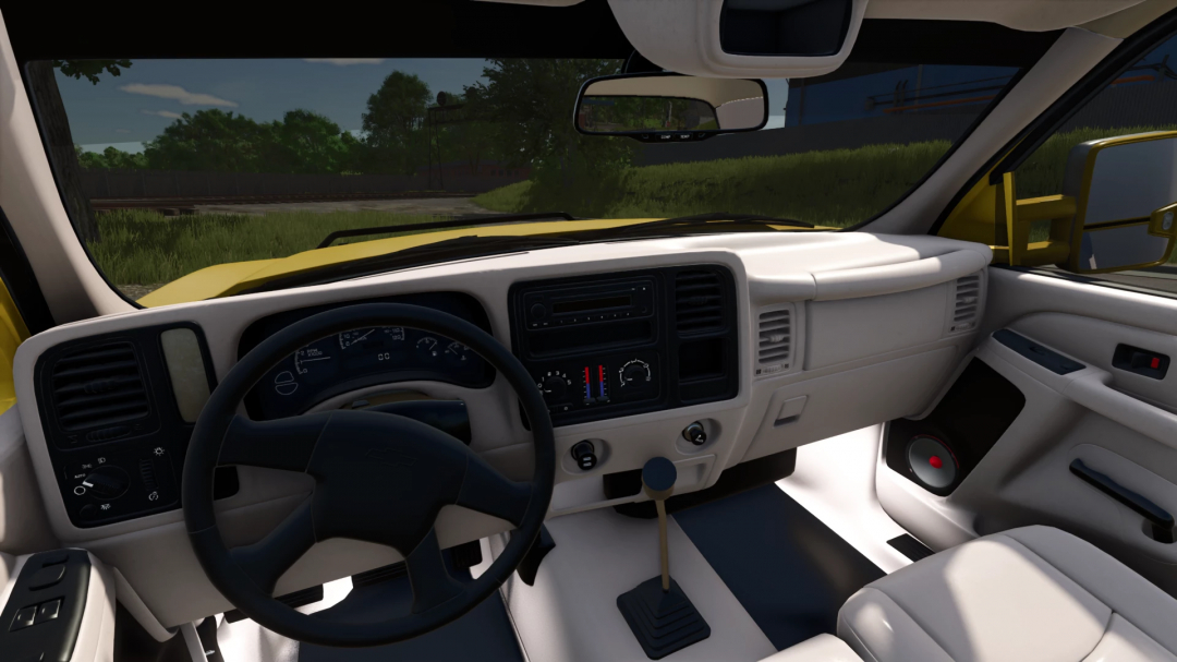 Interior view of 2005 Chevy 3500 cockpit in FS25 mod, showing the steering wheel and dashboard details.