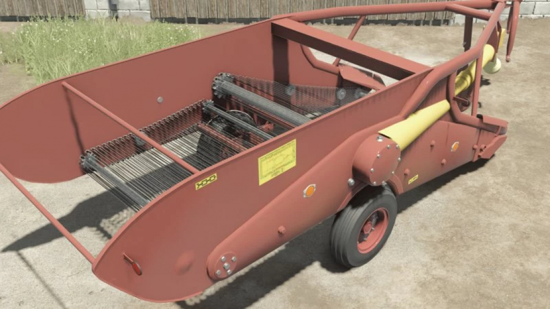 FS25 Agromet-Pionier Z-609 mod for Farming Simulator 25 showcasing agricultural machinery in red and yellow.