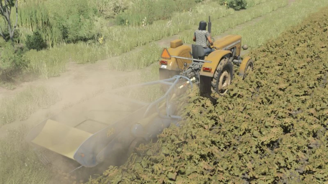 FS25 Agromet-Pionier Z-609 mod in Farming Simulator 25, showing a tractor working a field.