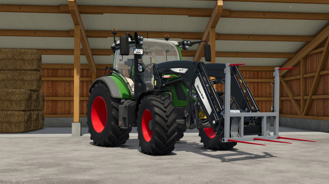 FS25 mod showing a tractor equipped with the Hydraulic Bale Fork in a barn setting.