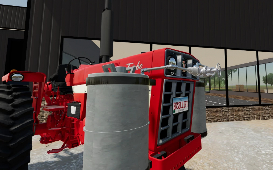 International Harvester 966 Propane mod for FS25 features a detailed red tractor parked at a modern barn.