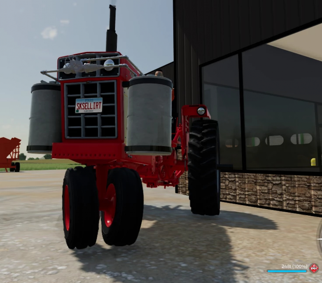 International Harvester 966 Propane tractor mod for Farming Simulator 25 displayed near a building.