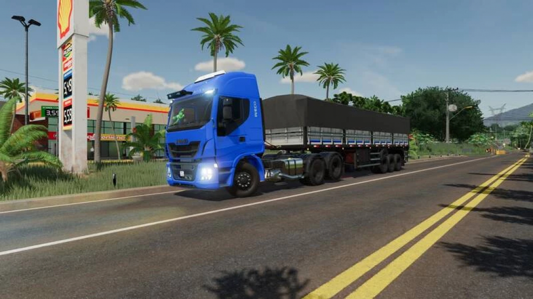 FS22 mod Iveco 440 Farias Chipped truck driving on a road next to a gas station in Farming Simulator 22.