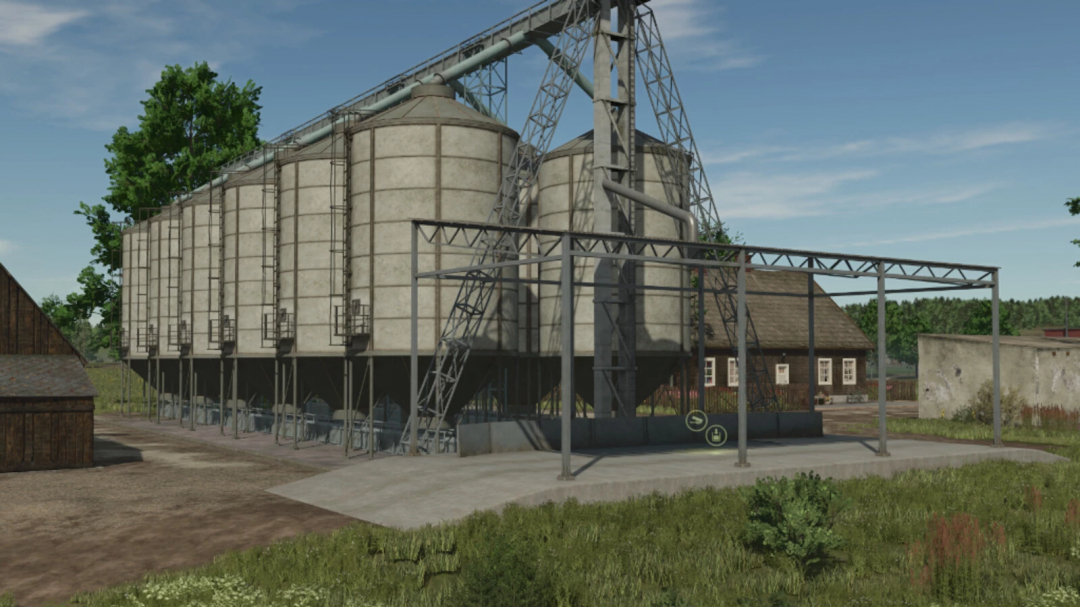 Large silos from the Large Silo Pack mod for FS25, featuring multiple storage tanks and structures in a rural setting.