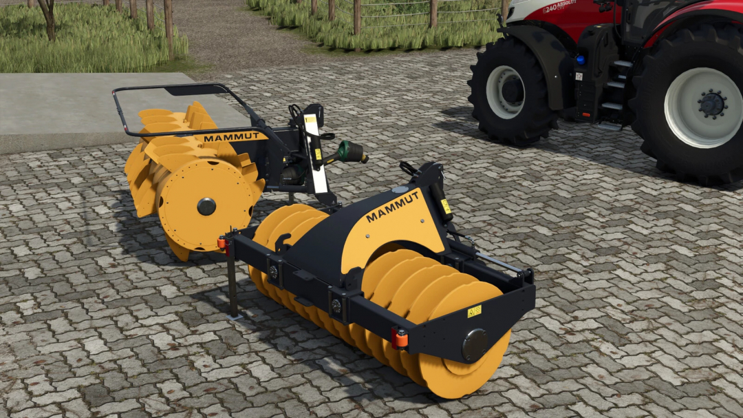 FS25 mods: Mammut Silo Compaction Pack v1.0.0.0, featuring yellow rollers on a cobblestone surface.