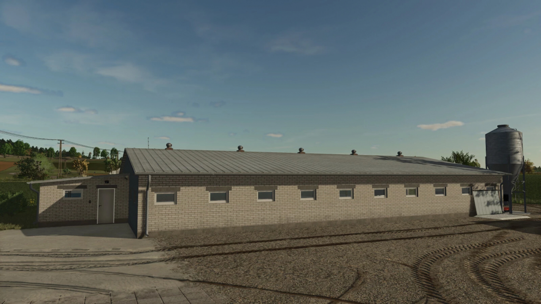 Modern Pigsty mod for FS25 in a rural setting, featuring a brick building and silo.