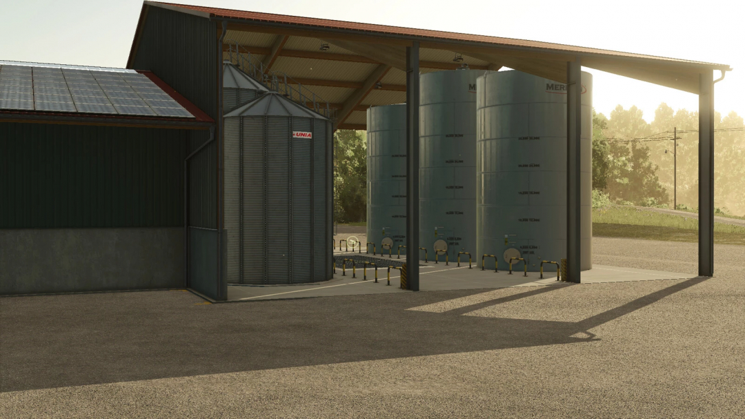 Multi-fruit farm storage mod in FS25, showcasing large silos under a metal structure.