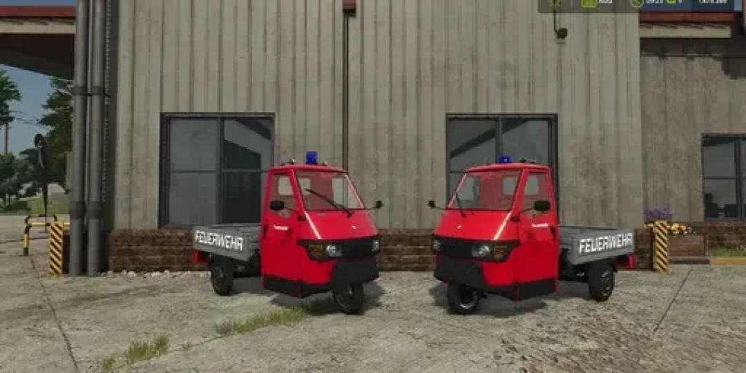 FS25 mods: Piaggio APE 50 Fire Department model shown in Farming Simulator 25, featuring two red vehicles parked outside a building.