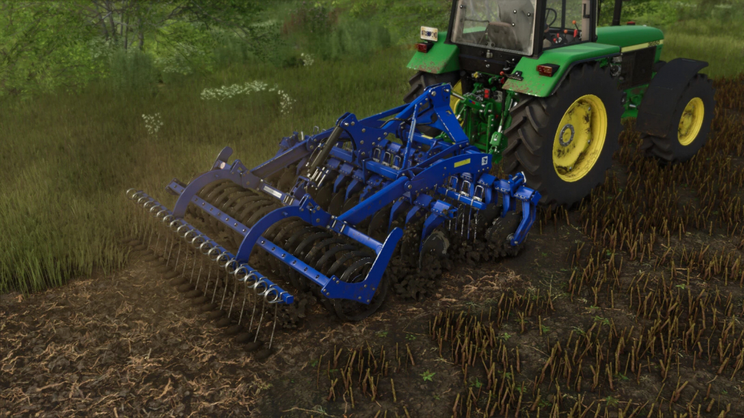 A green tractor uses the Rolmako U652 mod in FS25, cultivating a field.