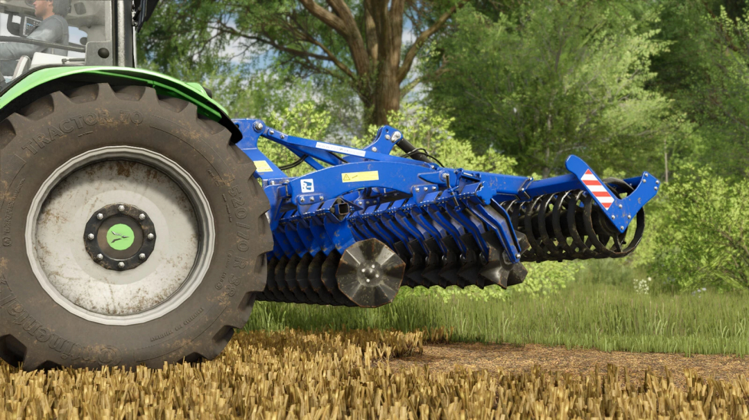 Rolmako U652 mod for FS25, showing a blue cultivator attached to a tractor on stubble field.