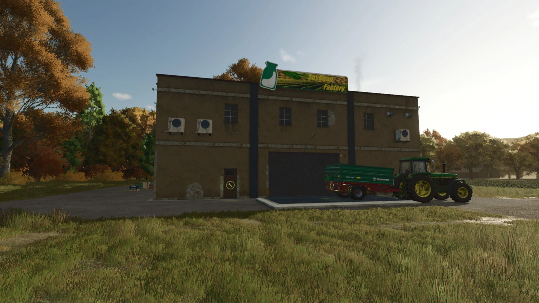 Soybean Factory mod in FS25 with a tractor and trailer in front, showcasing autumn scenery.