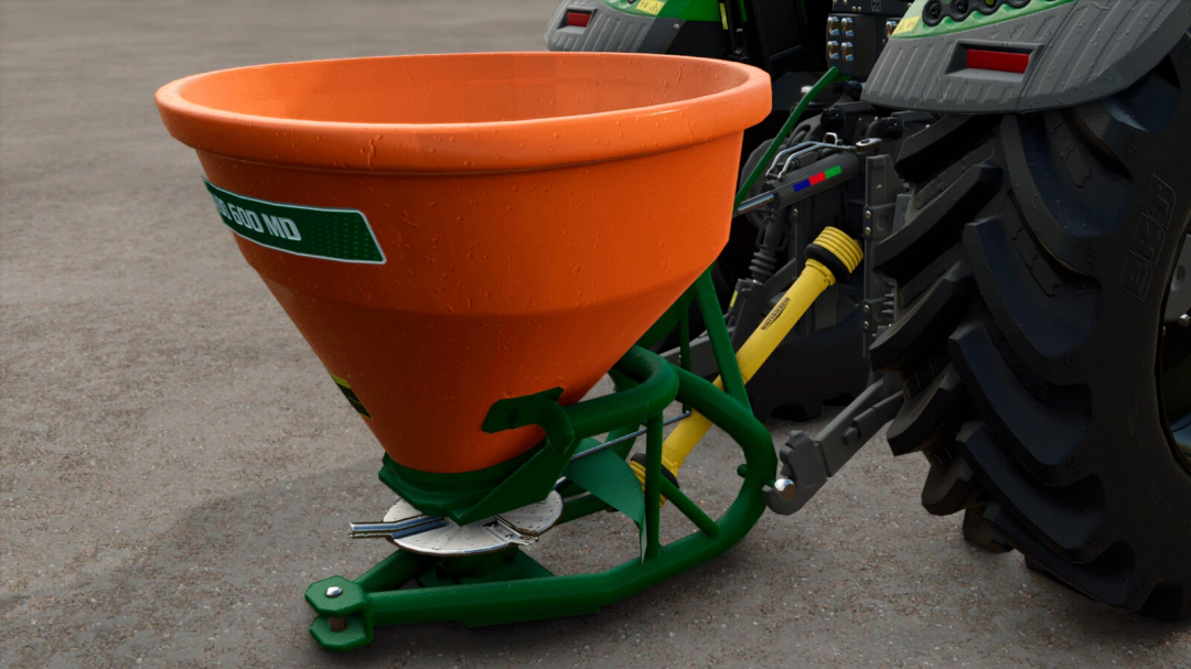 Stara Tornado 600 MD mod for FS25, showcasing an orange spreader attached to a tractor.