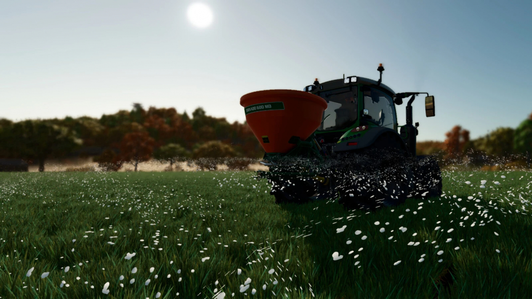 FS25 mod Stara Tornado 600 MD spreading fertilizer on a field with flowers, under a sunny sky.