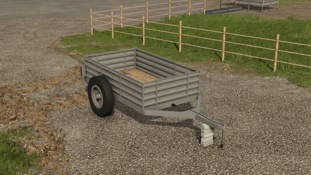 FS25 mod showing a two-wheel trailer on a paved lot with grass and fence backdrop in Farming Simulator 25.