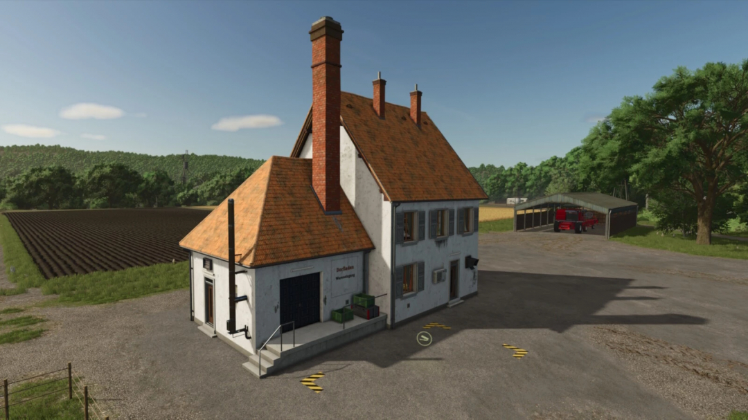 Village Shop mod in FS25 with a rustic building, fields, and trees.