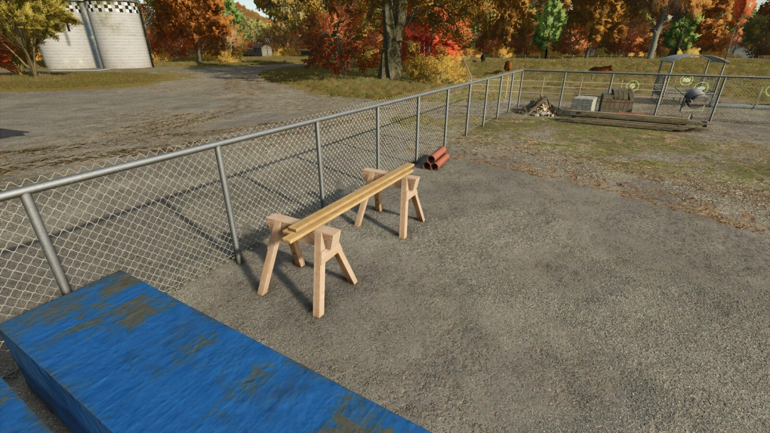 Image of wood trestle mod in FS25, featuring wooden sawhorses and beams in a fenced area, part of Farming Simulator 25 mods.