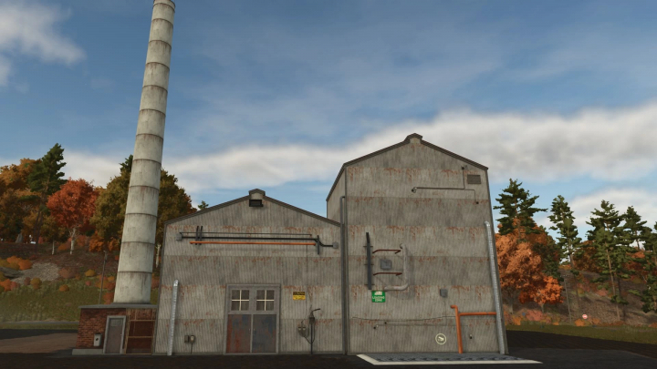 fs25-mods,  FS25 mods Stone Factory v1.0.0.0 in Farming Simulator 25, featuring a large industrial building with a smokestack amidst autumn trees.