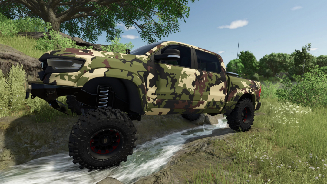 Camouflage 2021 Ram TRX mod in FS25, off-roading by a creek in a lush forest setting.