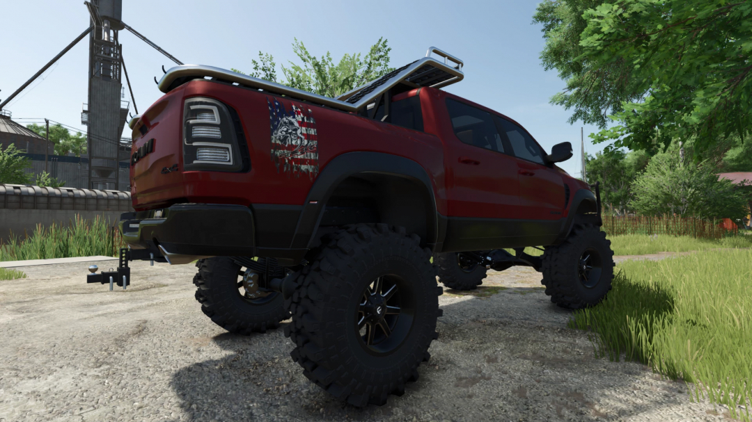 2021 Ram TRX mod in FS25, featuring a red pickup truck with large off-road tires, set in a rural landscape.