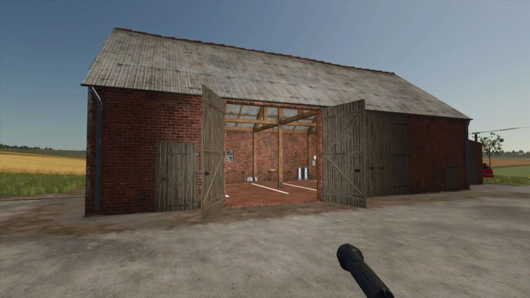 Brick shed and workshop mod in FS25 with open wooden doors showcasing the interior.