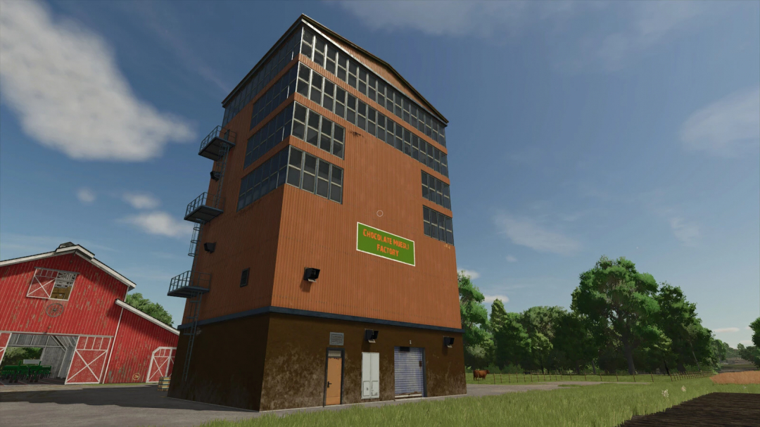 Chocolate Cereal Factory mod in FS25 with a tall industrial building next to a red barn.