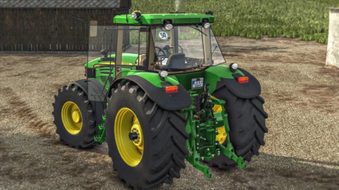 Rear view of FS25 John Deere 7020 mod in Farming Simulator 25, showcasing its large tires and green-yellow design.