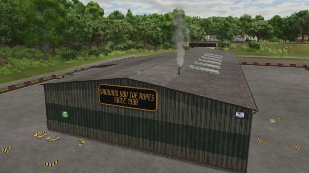 FS25 mod Faster Rope Production building with sign 'Showing You the Ropes Since 1998', surrounded by trees.