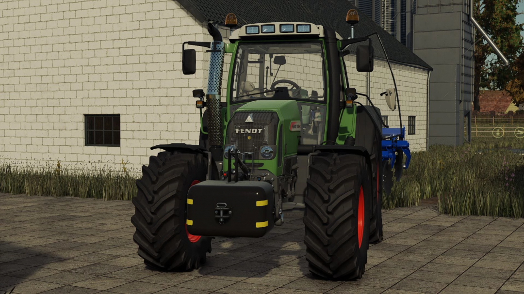 Fendt 400 Vario tractor mod in FS25 parked near a barn.