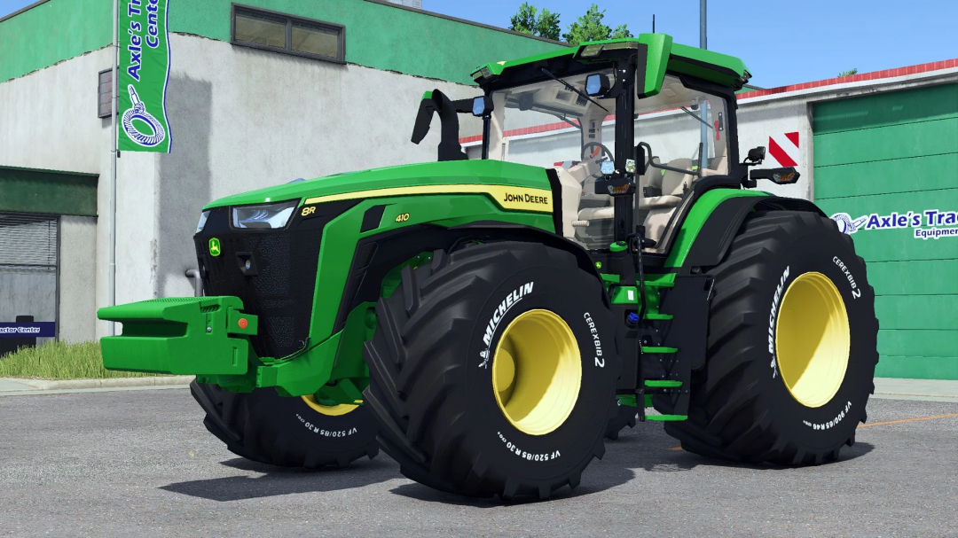 FS25 mods: John Deere tractor with engraved Michelin tires at a shop.