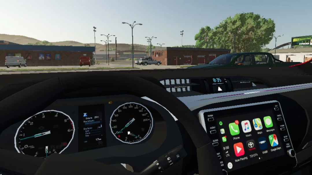 Interior view of Toyota Hilux 2022 in FS25 mod showing dashboard and digital display.