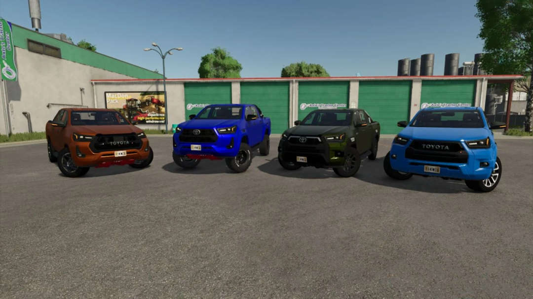 Four Toyota Hilux 2022 trucks displayed at a dealership in FS25 mods, showcasing different colors for Farming Simulator 25 mod.