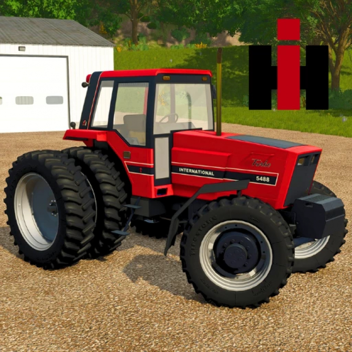 fs25-mods,  FS25 mod International 5x88 Series tractor parked near a garage, showcasing its red design and large tires. Farming Simulator 25 mods.