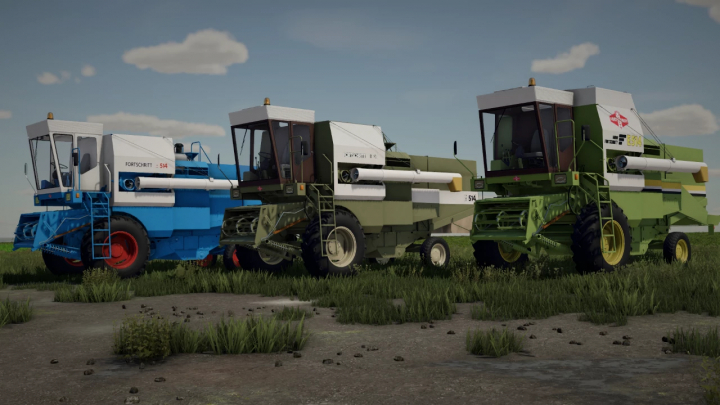 fs22-mods, Fortschritt E512 & E514 harvesters in FS22 mod, showcasing blue, green, and green-yellow models on a grassy field.