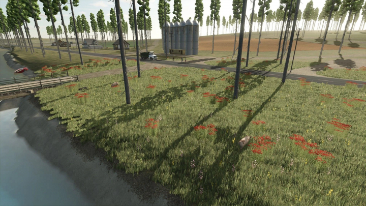 fs25-mods,  FS25 Old Kiwi Farm mod showcasing a scenic landscape with trees, grass, and silos.